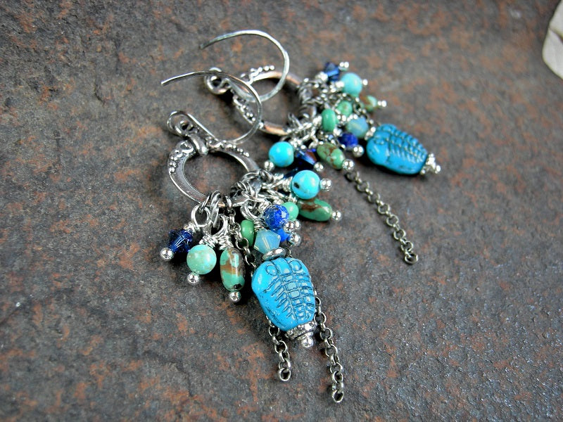 Boho cluster style earrings, with glass trilobite beads, Swarovski crystal, faceted lapis, genuine turquoise & sterling chain falls. 