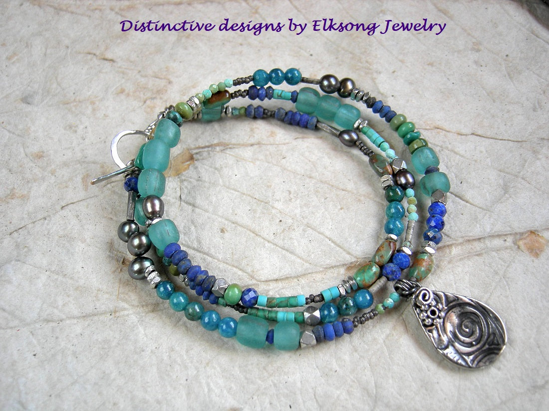 Dreamy blue asymmetrical necklace or wrap bracelet with lapis, turquoise, apatite, colored pearl & Java glass. Silver details & tear drop focal. 