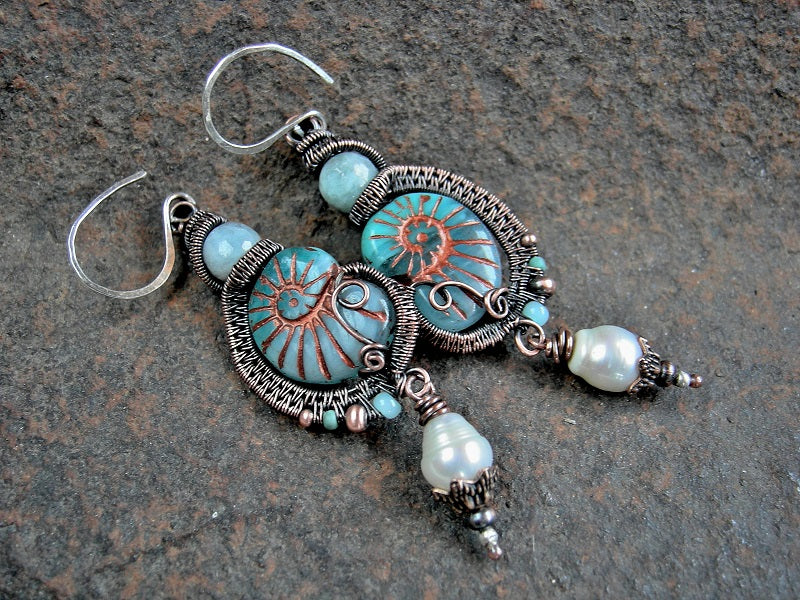 Boho luxe aqua glass nautilus bead & copper wire wrap earrings. Faceted aquamarine & freshwater pearls. 