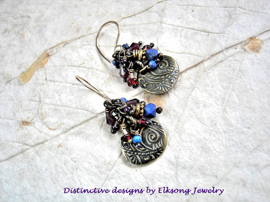 Lapis & garnet cluster style earrings with antiqued gold charms, violet African glass seed beads & 14kt gold filled earwires. 