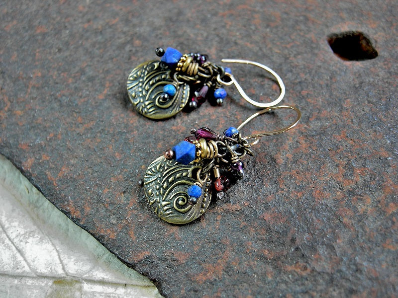 Bohemian cluster style earrings with faceted lapis & garnet beads,  antiqued gold charms, violet African glass seed beads & 14kt gold filled earwires. 
