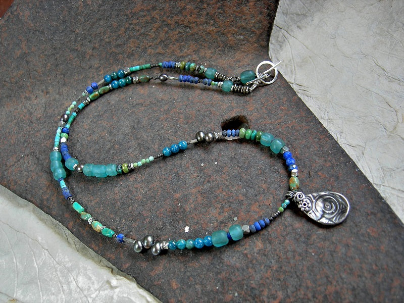 Bohemian asymmetrical necklace or wrap bracelet with lapis, turquoise, apatite, colored pearl & Java glass. Silver details & tear drop focal. 