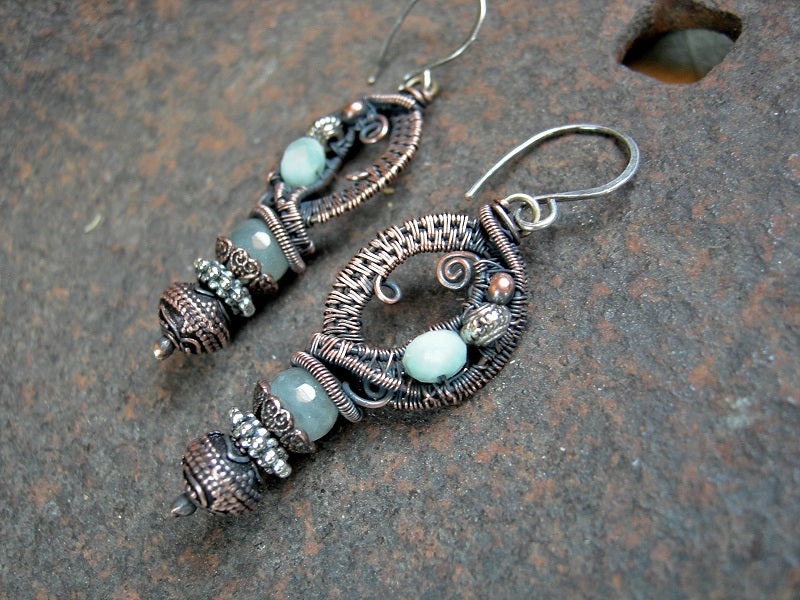 Oxidized copper wire wrap earrings set with faceted aquamarine, green moonstone, copper & silver beads. 