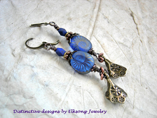 Deep Blue Sea earrings with oval blue glass, nautilus decorated beads, faceted lapis & antiqued gold scallop drops. 