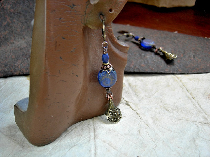 Deep Blue Sea earrings with oval blue glass, nautilus decorated beads, faceted lapis & antiqued gold scallop drops. 