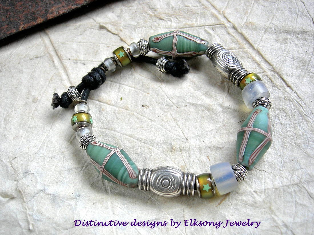 Chunky unisex sliding knot bracelet with aqua Java glass bi cone beads, Greek pewter beads, Dutch opal glass & glass color change beads. 