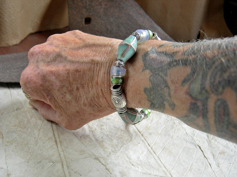 Chunky unisex sliding knot bracelet with aqua Java glass bi cone beads, Greek pewter beads, Dutch opal glass & glass color change beads. 