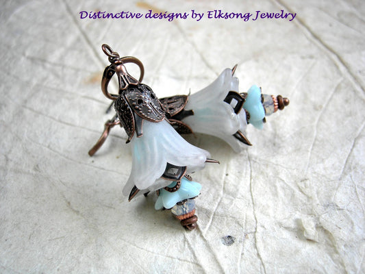 Faery bell earrings with white resin flowers, blue glass flowers, white opal crystal rondelles & copper filigree details. 