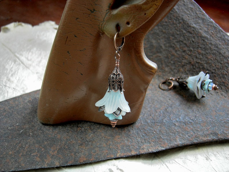 Faery bell earrings with white resin flowers, blue glass flowers, white opal crystal rondelles & copper filigree details. 
