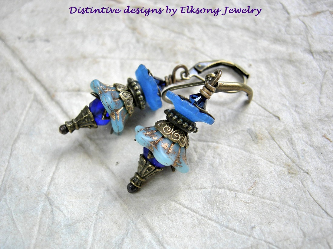 Blue flower earrings with glass & resin flowers, antiqued brass details & Swarovski crystals. 