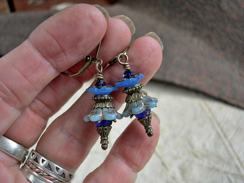 Vintage style blue flower earrings with glass & resin flowers, antiqued brass details & Swarovski crystals. 