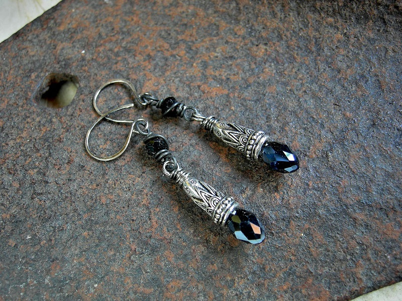 Boho luxe black & silver drop earrings with faceted tourmaline cubes, ornate silver cone caps & silvery black crystal teardrops. 