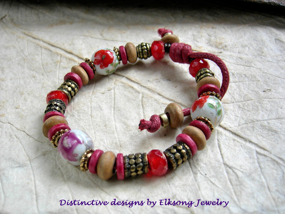 Fire Flower adjustable slider bracelet with vintage porcelain beads, sandalwood & Greek ceramic discs, faceted glass beads. Brass & red.
