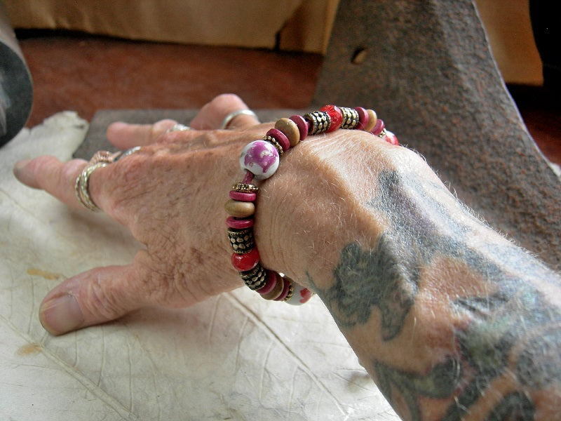 Adjustable slider bracelet with vintage red flower porcelain beads, sandalwood & Greek ceramic discs, faceted glass beads. 