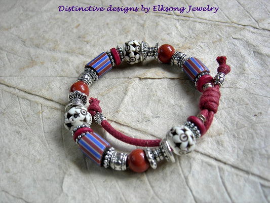Stripes & Stars, sliding knot bracelet with Venetian glass, red jasper, carved bone & silver details. Red cotton cord.