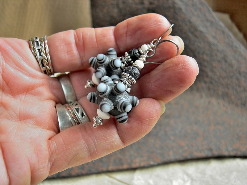 Unique artisan earrings with handmade ornate black & white lampwork glass bump beads, bone, lava stone & silver. 