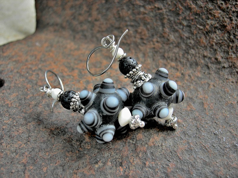 Bohemian earrings with handmade ornate black & white lampwork glass bump beads, bone, lava stone & silver. 