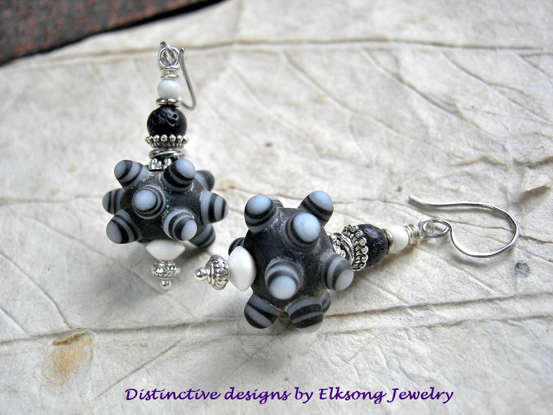 Basic black earrings with handmade ornate black & white lampwork glass bump beads, bone, lava stone & silver. 
