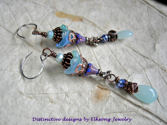 Ethereal long drop earrings in shades of blue & copper with glass flowers, teardrops & faceted crystal. 