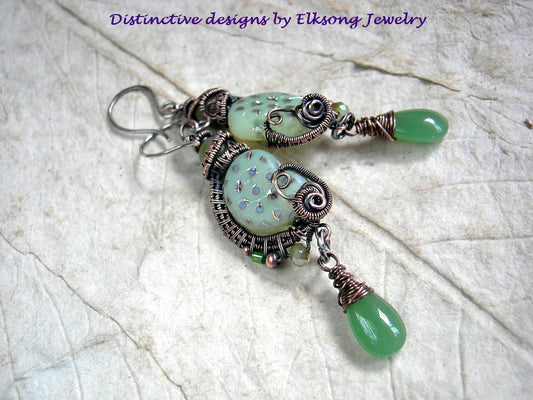 Luminous green nautilus earrings with oxidized copper wire wrap, jade beads & green glass tear drops. 