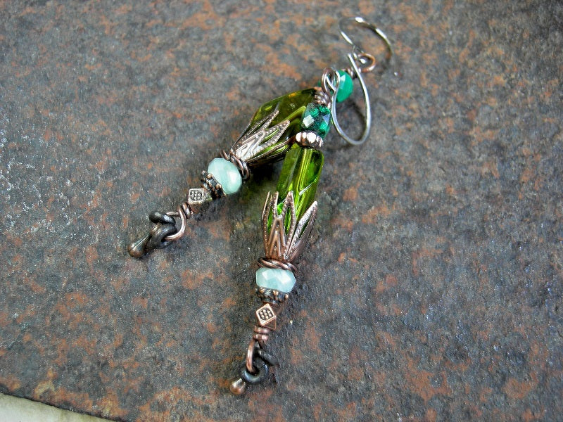 Bead stack style earrings with vintage green glass & gemstone beads, antiqued copper caps & beads. Rhodium ear wires. 