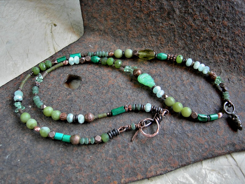 Asymmetrical wrap bracelet/necklace with jade, malachite, fluorite, moonstone & serpentine  beads, copper heishi & beads and handmade copper toggle clasp. 