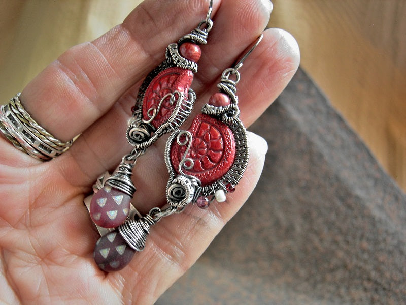 Red glass & gemstone nautilus earrings with pressed Czech glass beads, vintage coral rounds, faceted garnet, matte glass teardrops & sterling wire wrap. 