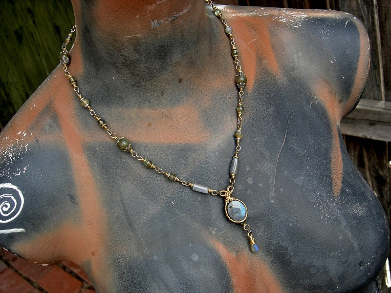 Glowing labradorite & golden brass necklace with wire wrapped links & hand made toggle clasp. 