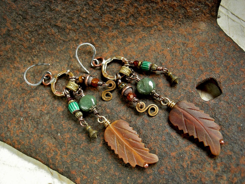 Richly colored statement earrings with green & orange gemstone, carved horn, vintage African glass & handmade stamped brass rings.
