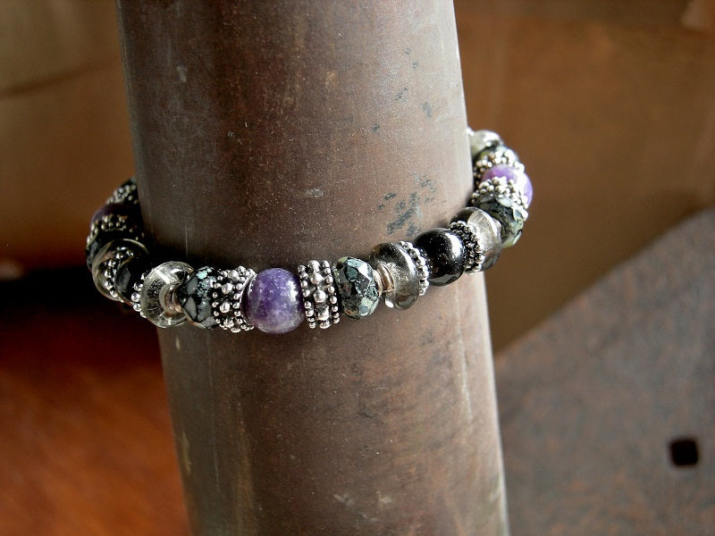 Purple & black gemstone adjustable slider bracelet with  black & grey glass and silver details. Black woven cotton cord.