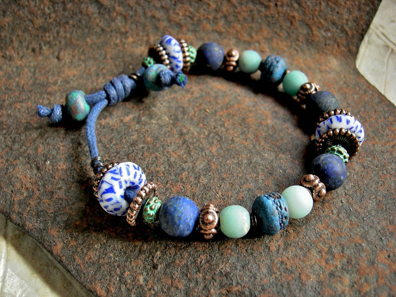 Boho unisex adjustable slider bracelet with lapis, amazonite, copper, glass & ceramic beads. 