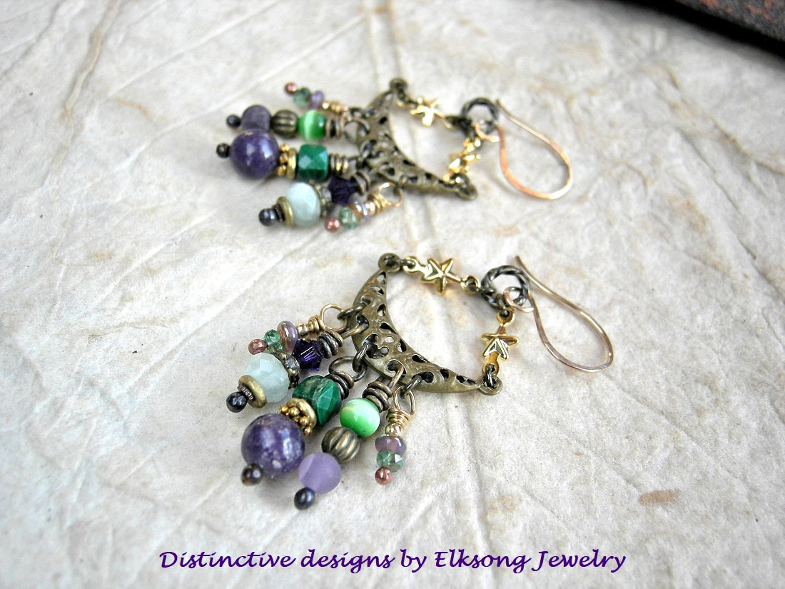 Juicy gemstone chandelier earrings with purple & green stone, glass & brass beads. Crescent moon & star connectors, 14kt gold ear wires. 