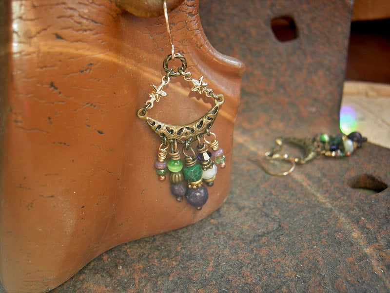 Whimsical gemstone chandelier earrings with purple & green stone, glass & brass beads. Crescent moon & star connectors, 14kt gold ear wires. 