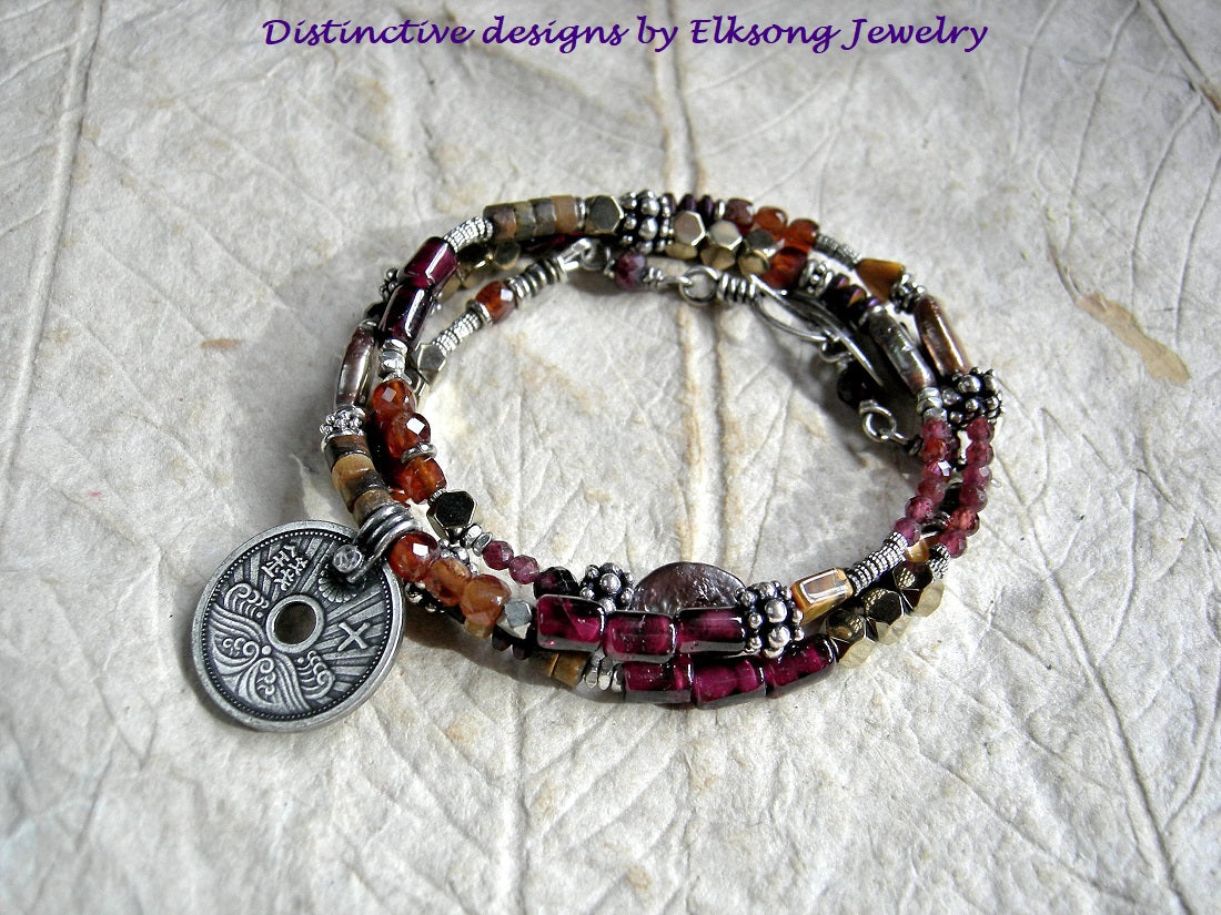 Boho luxe wrap bracelet/necklace with orange, gold & red gemstone, silver coin focal & details, handmade toggle clasp. 
