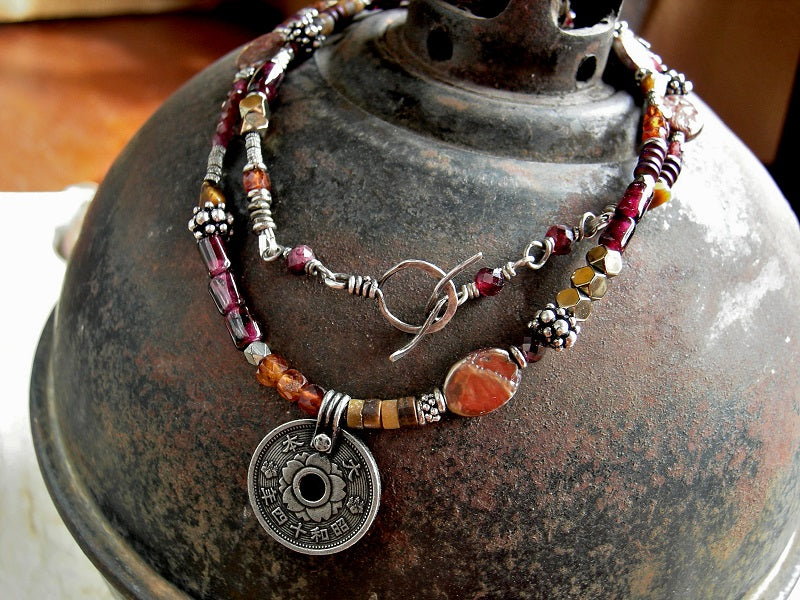 Bohemian wrap bracelet/necklace with orange, gold & red gemstone, silver coin focal & details, handmade toggle clasp. 