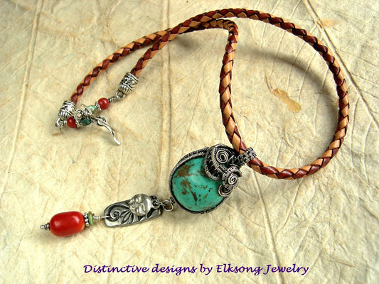 Turquoise & sterling wire wrap necklace, on braided leather bolor cord, with coral beads & silver charms. 