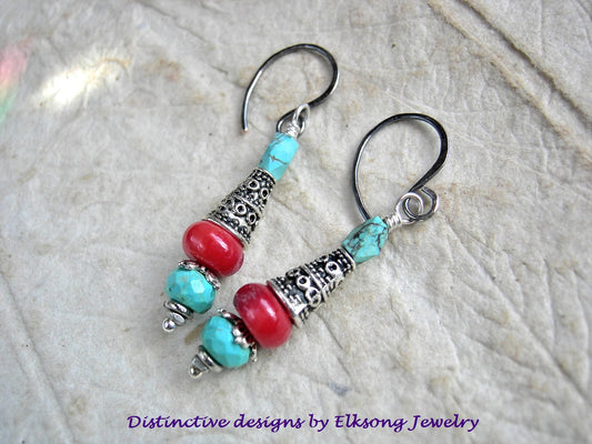 Simple gemstone drop earrings with coral, genuine turquoise & silver finish cone caps. Sterling ear wires. 