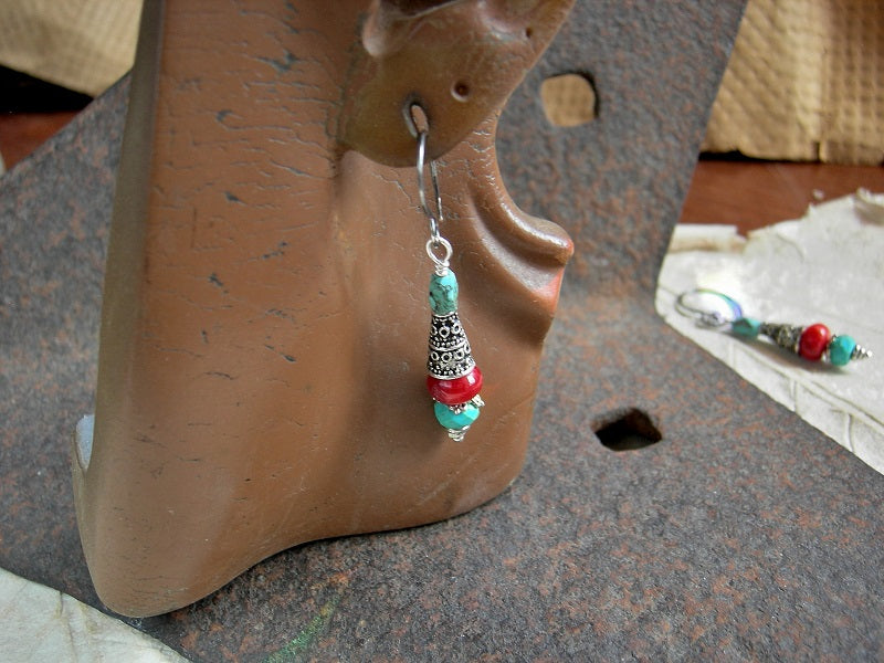 Simple gemstone drop earrings with coral, genuine turquoise & silver finish cone caps. Sterling ear wires. 