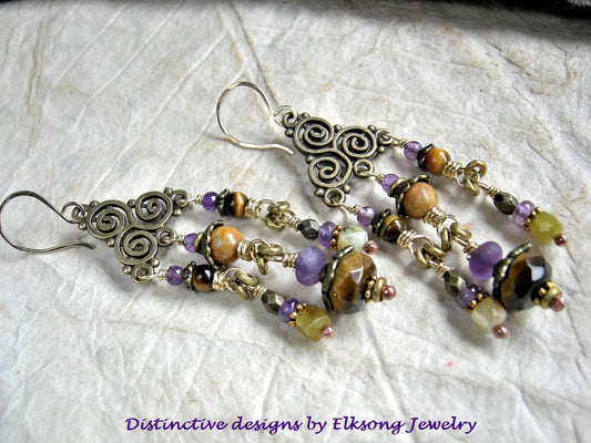 Triple spiral chandelier earrings in antiqued brass with amethyst, tiger eye, yellow opal & fossilized coral gemstone beads. 14kt gf ear wires. 
