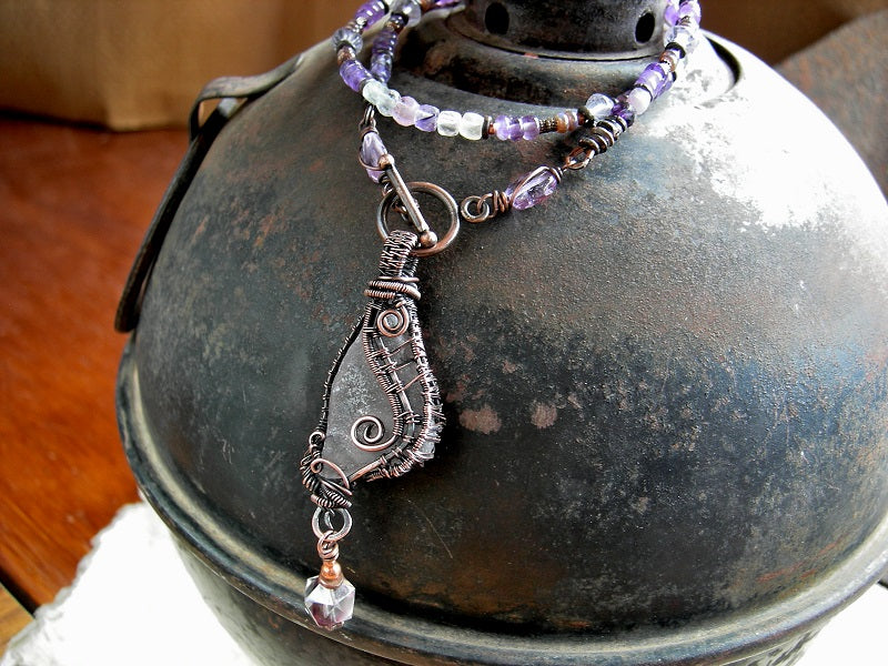Boho stung bead style necklace with sea glass "wing" & copper wire wrap focal, amethyst, fluorite & copper beads. 