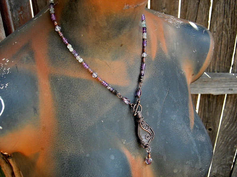 Stung bead style necklace with sea glass "wing" & intricate copper wire wrap focal, amethyst, fluorite & copper beads. 