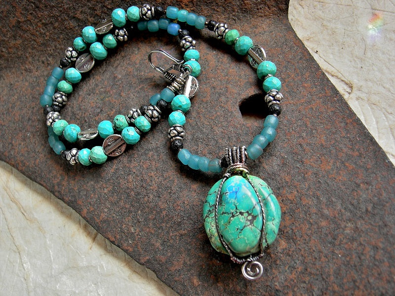 Unisex Hubei turquoise necklace with aqua Java glass, black lava stone & sterling wire wrap. 