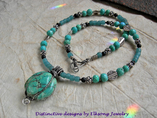 Chunky turquoise necklace with aqua Java glass, black lava stone & sterling wire wrap. 