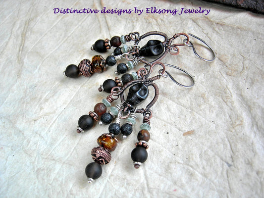 Black & copper chandelier earrings, hand formed copper wire wrap hanger, black sugar skulls, dark gemstone beads. 