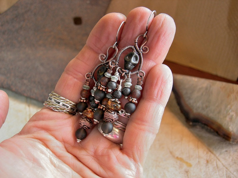 Copper wire wrap chandelier earrings, with hand formed hangers, black sugar skulls, dark gemstone beads. 