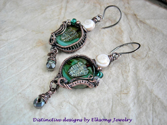 Sea Fossil earrings with aqua glass trilobite beads in copper wire wrap, glass, copper & conch shell beads & faceted abalone drops. 