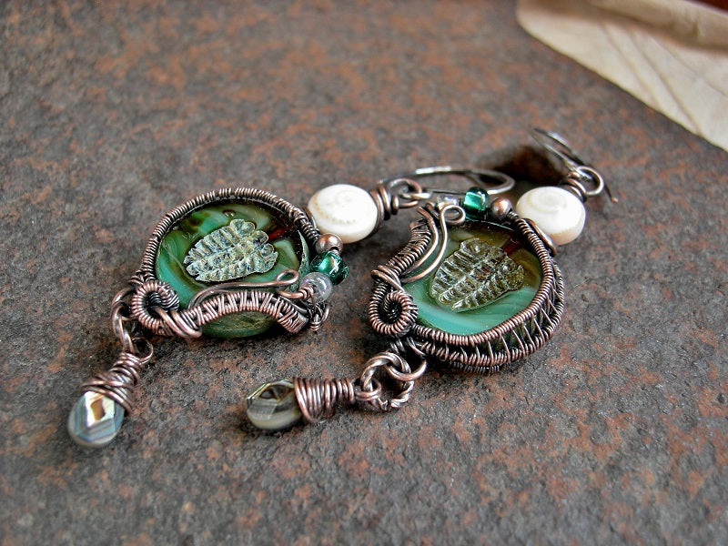 Aqua glass trilobite bead earrings with copper wire wrap, glass, copper & conch shell beads & faceted abalone drops. 