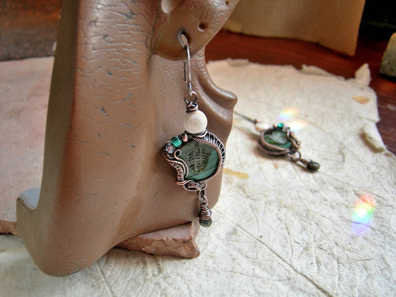 Copper wire wrap & aqua glass trilobite bead earrings with glass, copper & conch shell beads & faceted abalone drops. 