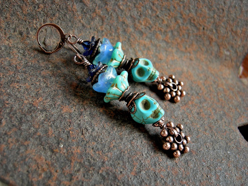 Sugar skull earrings, Dia de los Muertos style, with turquoise magnesite skull beads, glass flowers & copper. 