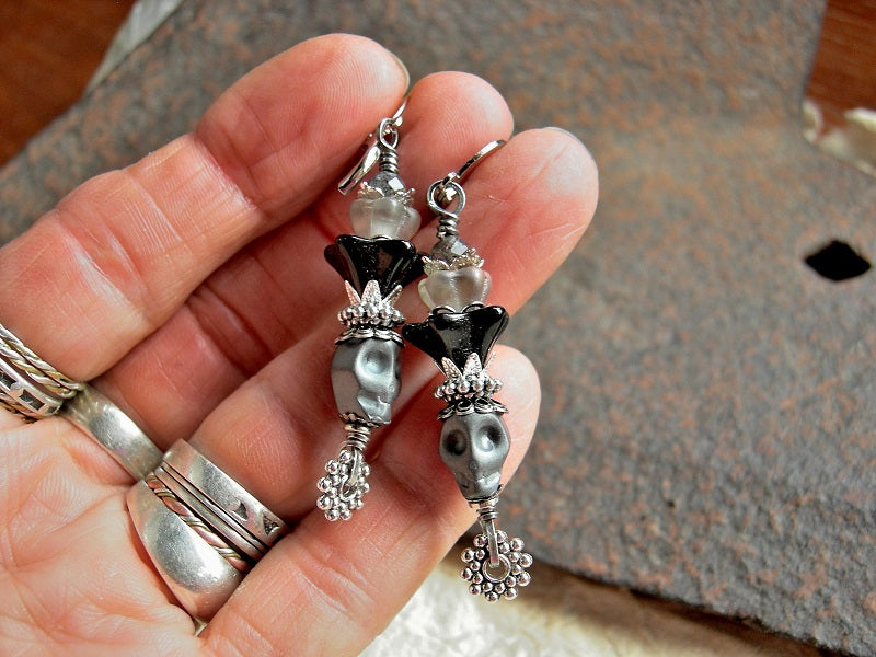 Dark gray sugar skull earrings with black & gray glass flowers, silver & faceted quartz beads. 